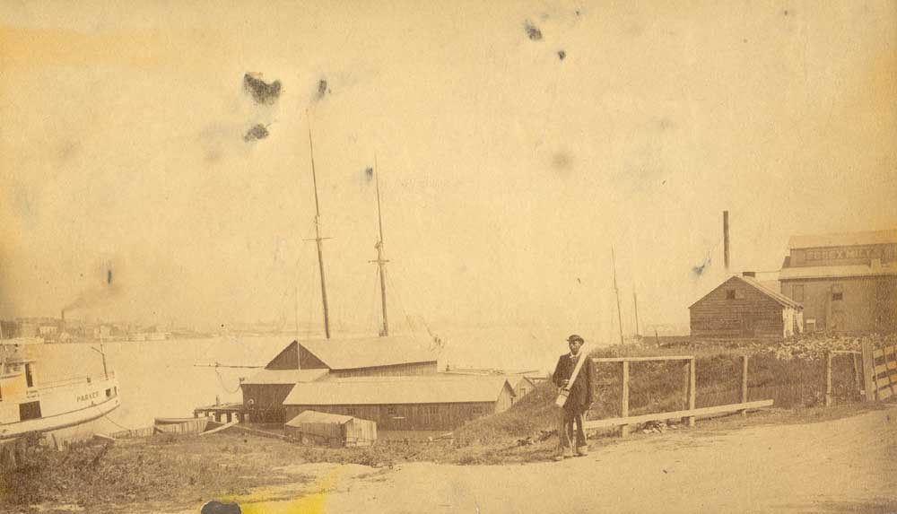 Non-uniformed letter carrier on the riverfront in 1886