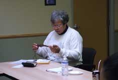 Nancy Allen inspects an artifact at �The African Canadian Freedom Journey in Memory� workshop 05/02/2005