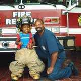 Firefighter Carey Chase with nephew Cornell, July 17, 2005, photo courtesy of Carey Chase 