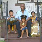 Firefighter George Copeland with his children, twins Maxwell and Tira and big brother Chad  Photo Courtesy of George Copeland 