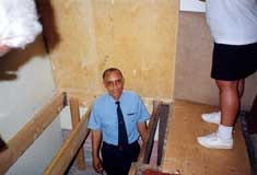 A demonstration of the trapdoor in the floor of the church  Photo courtesy of Cousin Kathleens Guide Service  