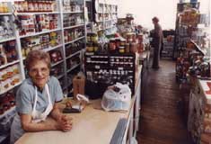P10804 - P10804 - Kay DeMarco (also known as 'The Cheese Lady') at DeMarco Groceries, June 1983. Courtesy of the Windsor Star