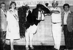 1980 Royal Winter Fair.  From left to right: Maurice Jebson (Royal Holstein Judge), Ontario Dairy Princess Mary Bradfield; Bertram Stewart; and Frank Tedesco.