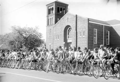 P10522 - Cyclists lined up outside St. Angela church on Erie St. ready for the 1964 race to begin. Courtesy of St. Angela Merici Church.