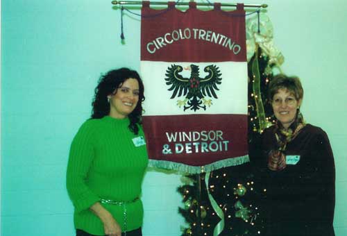 President Mary Jo (Zanoni) Schaffer and former president Mariagrazia Pedri with the club banner