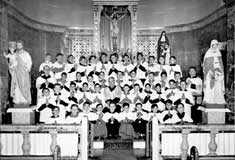 P10471 - Group of altar boys with Fr. John Stopponi, Fr. De Santis, and Fr Beda Barcatta, 1940s. Courtesy of St. Angela Merici Church